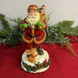 Home for the holidays vision of Santa Claus music box and figurine. New in box